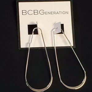 BCBGeneration Silver Tone Elongated Hoop Earrings